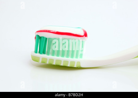green tooth brush with white paste isolated Stock Photo - Alamy