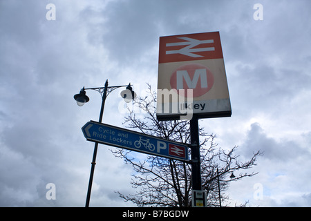 Train Station Sign and Lamp post located in Ilkley in West Yorkshire Stock Photo