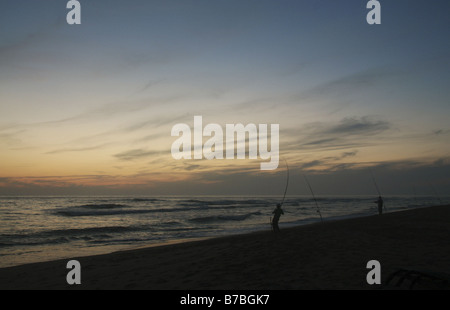 23 September 2008 Fishermen on beach after sunset Zahora Cadiz Andalucia Spain Stock Photo