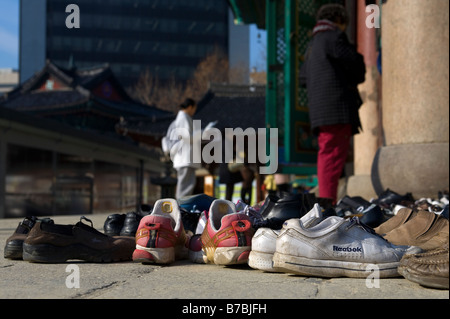 Shoes outside Hall of the Great Hero or Daeung jeon at Jogyesa Buddhist Temple, Seoul, South Korea Stock Photo