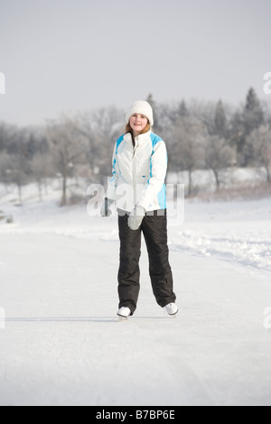 13 year old girl skating on Red River, Winnipeg, Canada Stock Photo