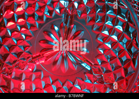 Colored lights on a patterned china glass Stock Photo