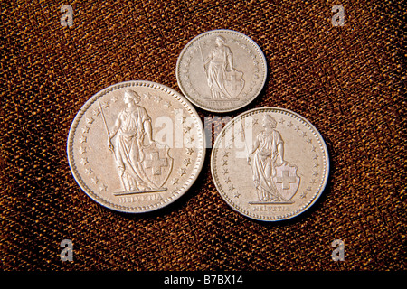 Swiss coins still in use Large 2 Swiss Francs Medium 1 Swiss Franc Small 1 2 Swiss Franc economy bank money cash Stock Photo