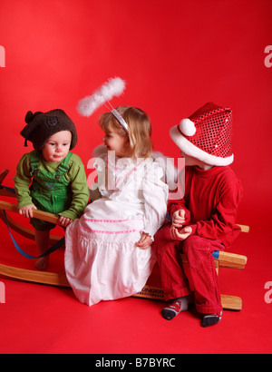 Christ Child, Santa Claus and Christmas gnome Stock Photo