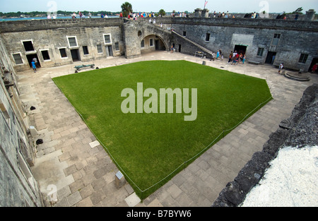 A courtyard view as visitors walk along Castillo de San Marcos, a 17th century fort National Monument, in St. Augustine, Florida Stock Photo