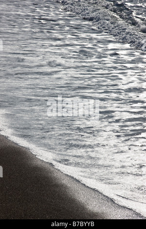 Close up abstract view of waves washing up on the beach at San Simeon State Park, San Simeon, California, USA Stock Photo