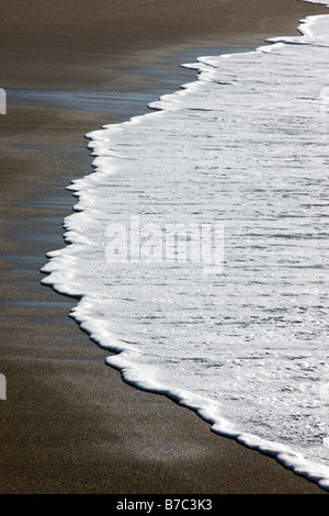 Close up abstract view of waves washing up on the beach at San Simeon State Park, San Simeon, California, USA Stock Photo