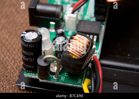 Electronic printed circuit board with computer chips, resistors, capacitors, other parts. Stock Photo