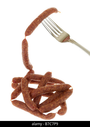 Fresh Tasty Spiced Pfiffikus Austrian Sausages On A Fork Isolated Against A White Background With No People and A Clipping Path Stock Photo