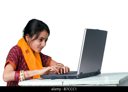 indian girl and laptop computer isolated on white Stock Photo