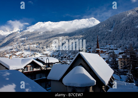 Church and mountains surrounding Zermatt Switzerland Stock Photo