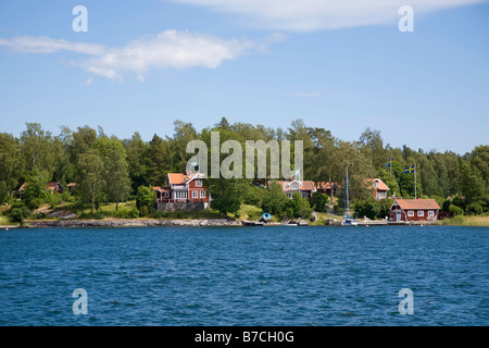 Traditional red painted houses on the 'island of Blido' in the 'Archipelago of Stockholm' Sweden. Stock Photo