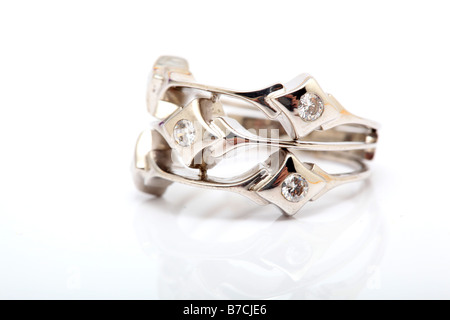 closeup white gold ring with gem stones isolated and reflected Stock Photo