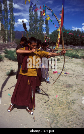 monk in archery contest Shey Ladakh Indian Himalaya Stock Photo