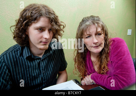 Woman training young man on computer Stock Photo
