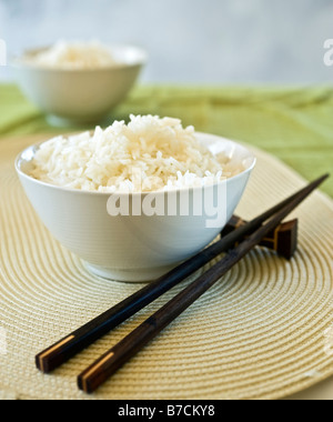 two bowls of plain rice and chopsticks Stock Photo