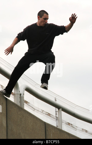 Parkour athlete at a daring jump over obstacles, Austria, Vienna, Donauinsel Stock Photo