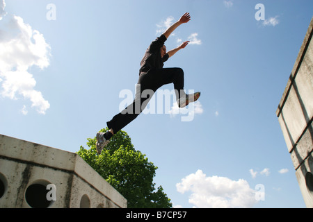 Parkour athlete at a daring jump over obstacles, Austria, Vienna, Donauinsel Stock Photo