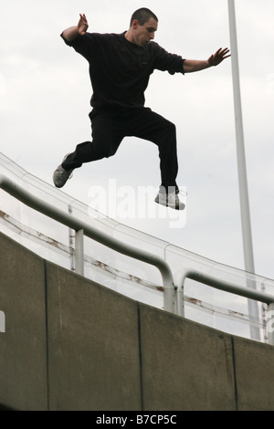 Parkour athlete at a daring jump over obstacles, Austria, Vienna, Donauinsel Stock Photo