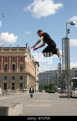 Parkour athlete at a daring jump over obstacles, Austria, Vienna, Donauinsel Stock Photo