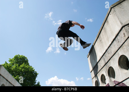 Parkour athlete at a daring jump over obstacles, Austria, Vienna, Donauinsel Stock Photo