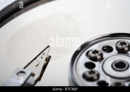 fingerprint left on the disc of an opened computer hard drive Stock Photo