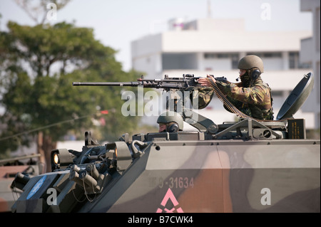 Taiwanese Soldier Firing A M2 Machine Gun In A CM-22 Armored Carrier, Taichung, Taiwan Stock Photo