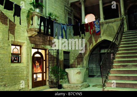 Washing hanging in an inner courtyard of an old house at night Split Croatia Stock Photo