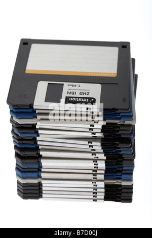 pile of old style floppy discs on a white background Stock Photo