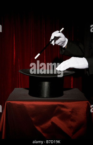 A magician's gloved hands performing a magic trick Stock Photo