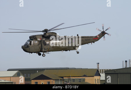 British Royal Navy Westland Sea King HC4 troop carrying helicopter flying at low level January 2009 Stock Photo