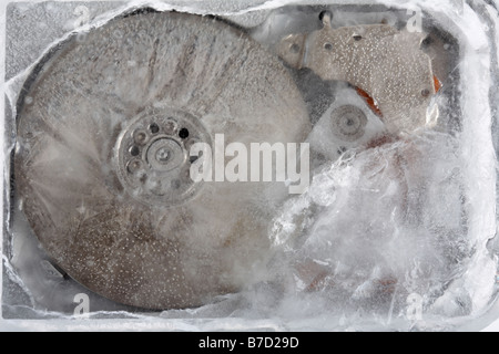 computer hard drive frozen in a block of ice Stock Photo