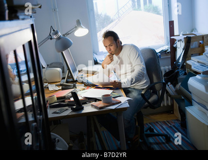 Man working in his home office Stock Photo