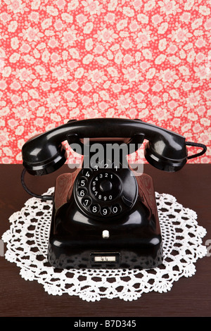 An old fashioned telephone on a dresser Stock Photo