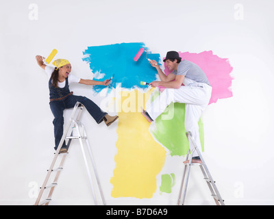 Couple posing on ladders. Stock Photo