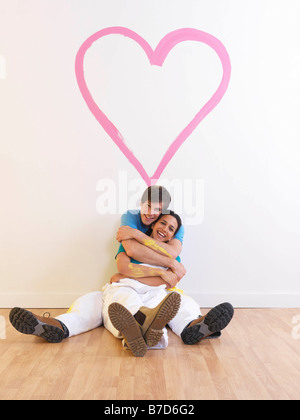 Couple with heart painting. Stock Photo