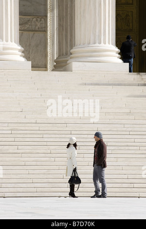 Couple standing in front of the US Supreme Court building - Washington, DC USA Stock Photo