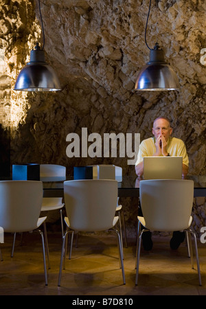 Man working on a laptop computer Stock Photo