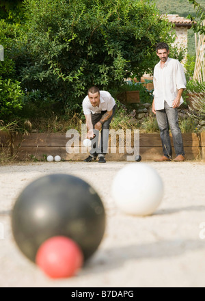 Two men playing bocce ball Stock Photo