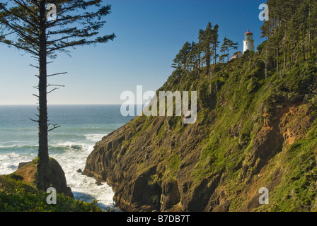 Coastline near Heceta Head Lighthouse visible in distance on cliff near Florence Oregon USA Stock Photo