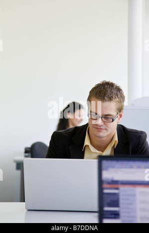 Workers in busy office Stock Photo