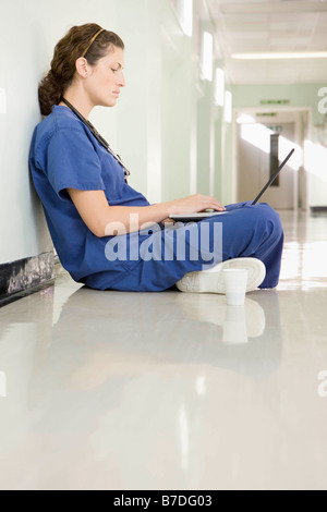 A female doctor on her laptop Stock Photo