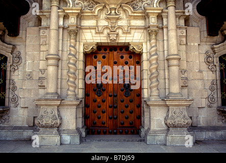 wooden doors, entrance, Archbishop's Palace, Palacio Arzobispal, sacred building, Plaza de Armas, city of Lima, Lima Province, Peru, South America Stock Photo