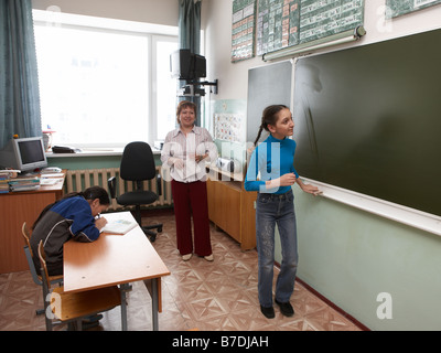 Students in classroom with teacher, Amguema, Chukotka,  Siberia Russia Stock Photo