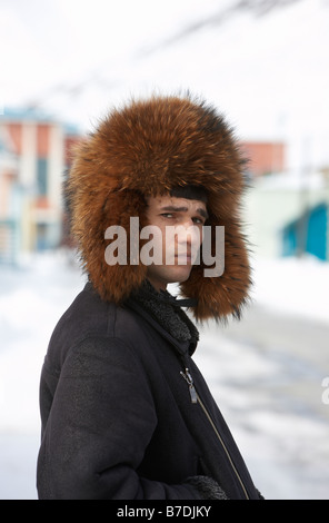 Man wearing fur hat, Amguema, Chukotka,  Siberia Russia Stock Photo