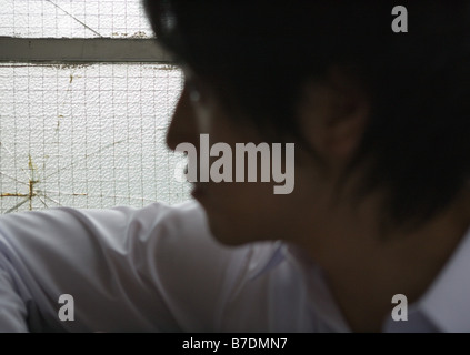 Side view of young man Stock Photo