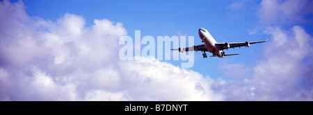 Commercial Airplane / Aeroplane in Sky approaching YVR Vancouver International Airport, Richmond, BC,  British Columbia, Canada Stock Photo