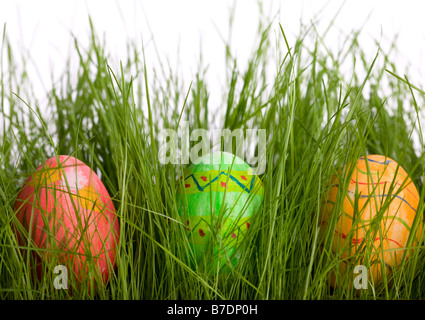 Three Easter eggs in fresh green grass Stock Photo