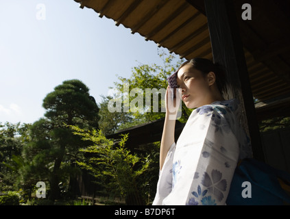 Woman wearing Yukata with hand towel
