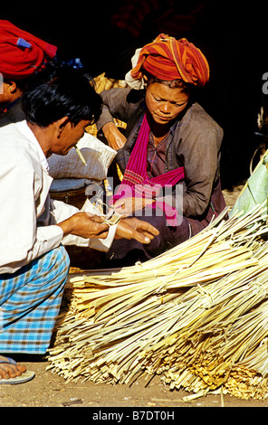 Traditionally dressed Burmese people and vendors at market on Inle Lake Shan State Burma Myanmar Stock Photo